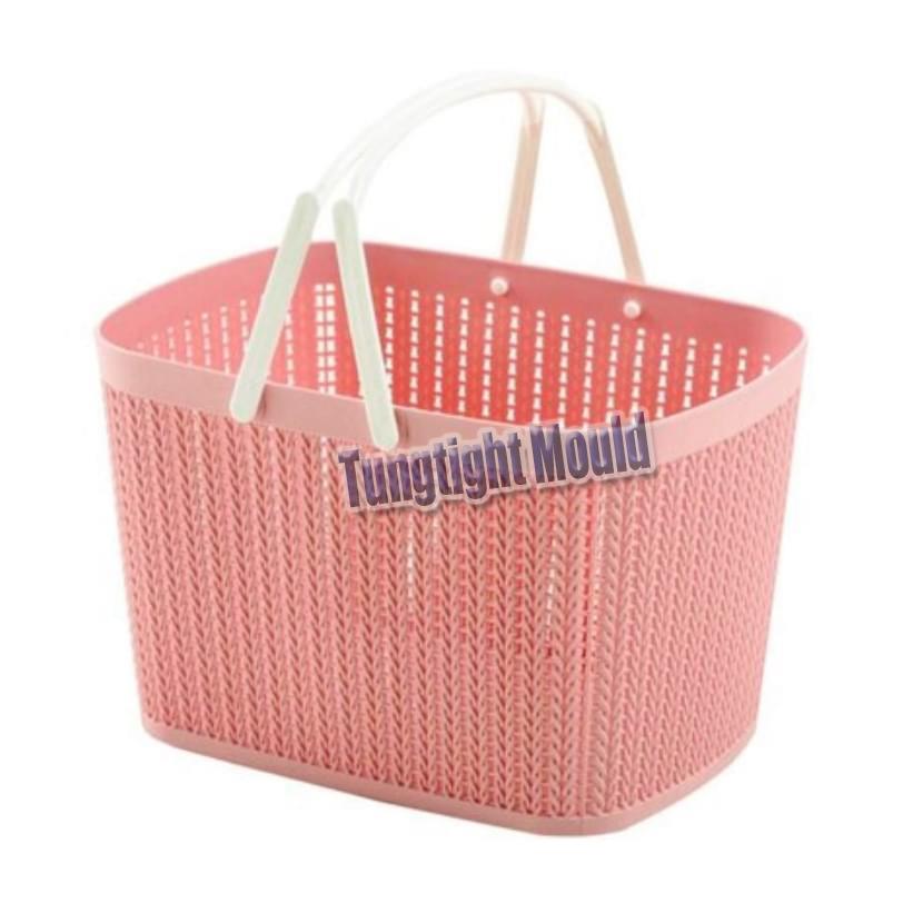 Plastic storage basket with handle mould