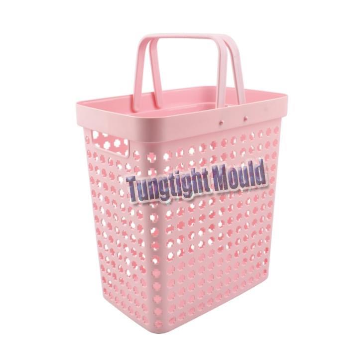Plastic storage basket with handle mold